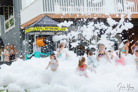 Foam party in full swing outside a building