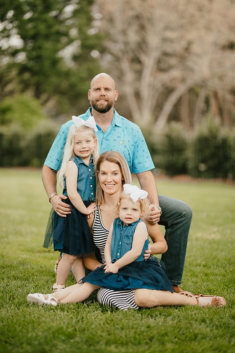 Family relaxing together on the grass