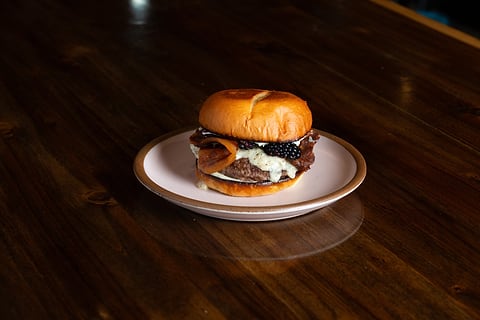 Gourmet burger on a plate, restaurant menu photo