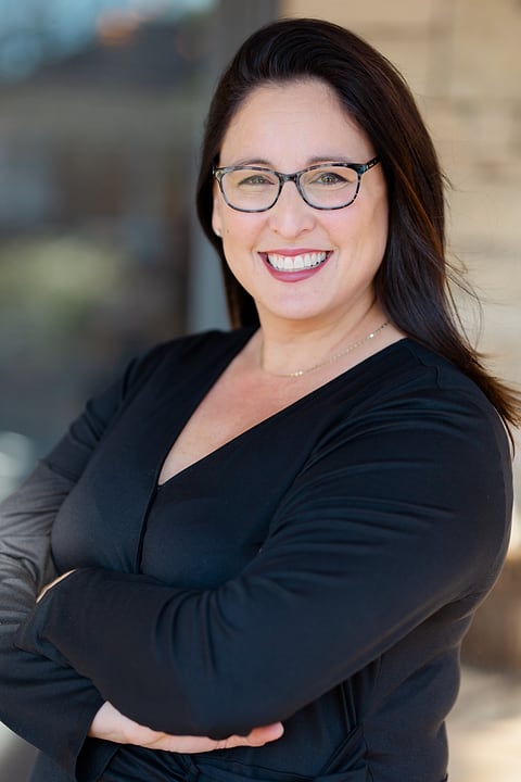 Outdoor branding portrait of a smiling woman