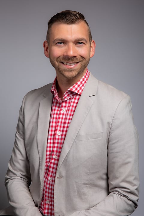Business portrait on a light gray backdrop