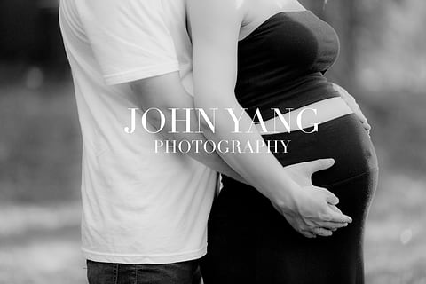 Black and white close-up of a baby bump