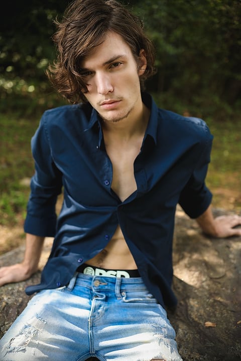 Male model in an open navy shirt
