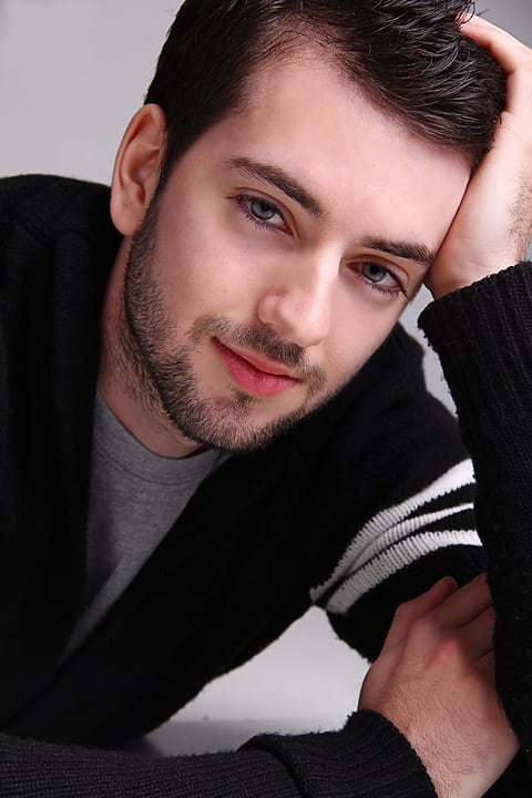 Male model resting his head on his hand