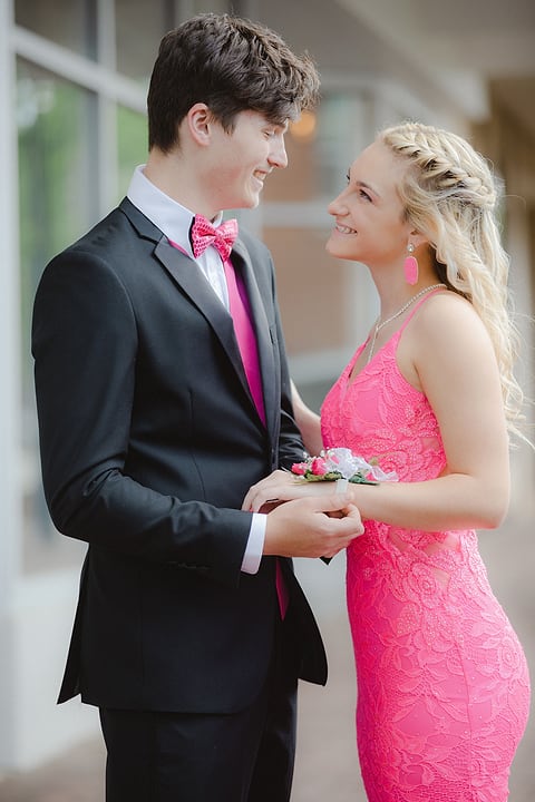 Prom couple smiling at each other